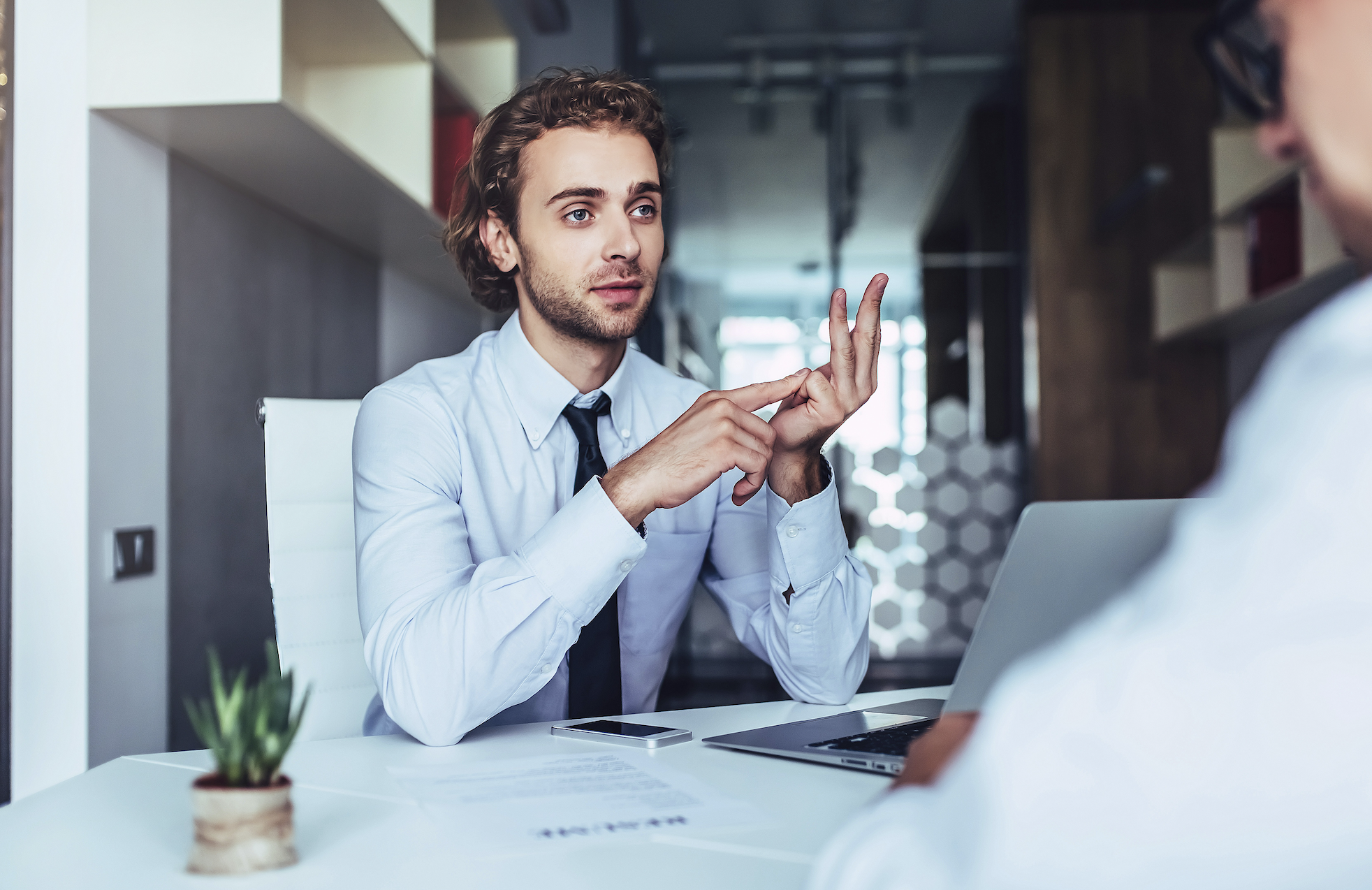 The candidate asks a professional question shortly before the job offer is revoked.