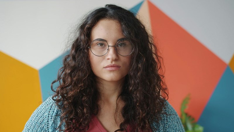 Young mom gives annoyed expression at her husband