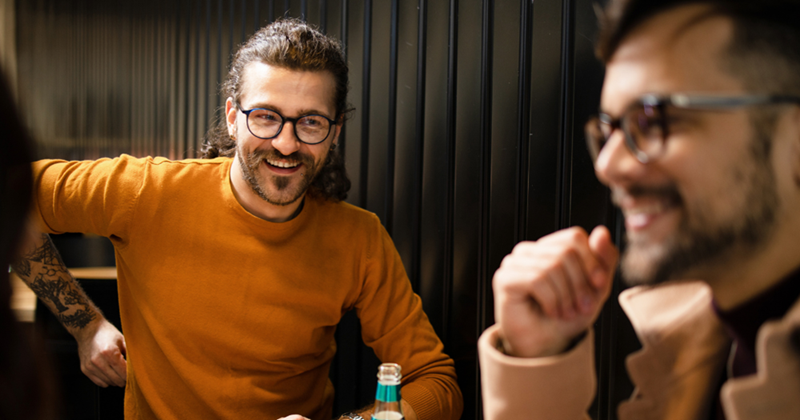 Friends sharing a conversation at the restaurant.