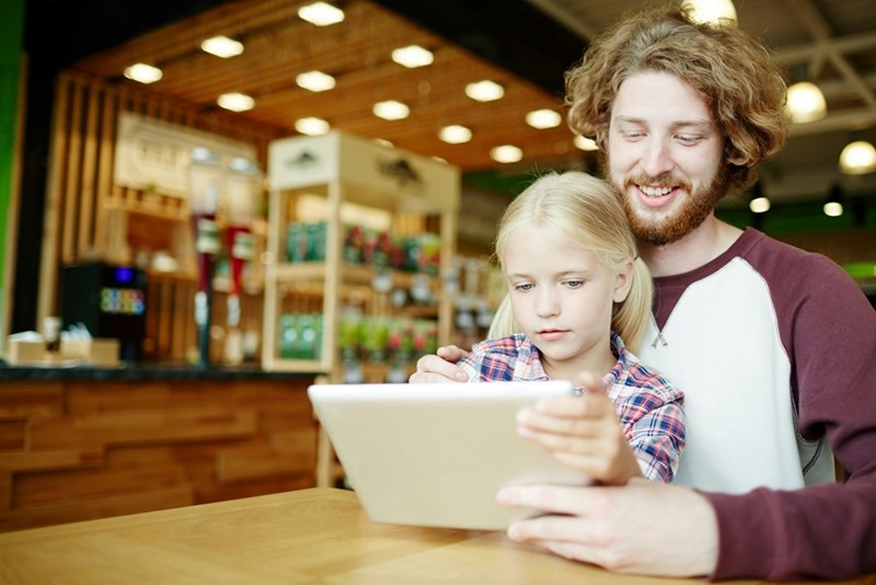 An employee's young daughter grabs his iPad while he's on a call.