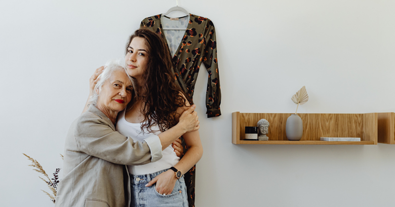 Granddaughter hugging her grandma.