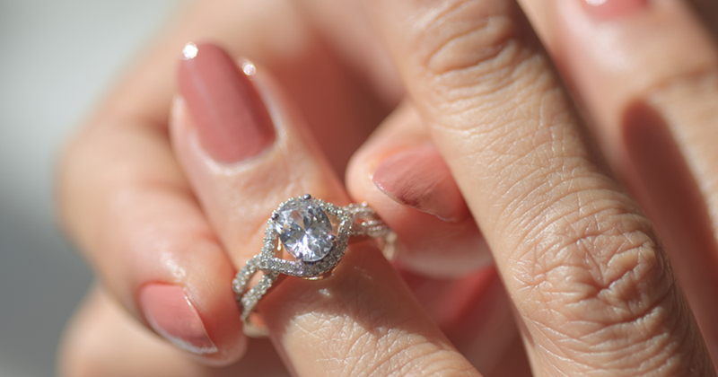 Woman trying on an engagement ring.