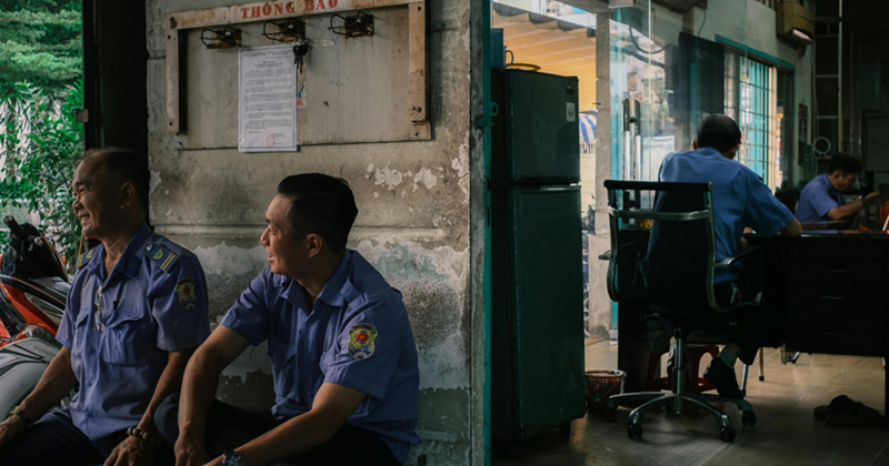 Night security guards taking a break away from the desk. 