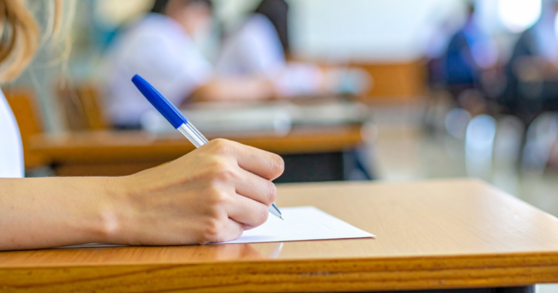 Student Taking a Test in Classroom