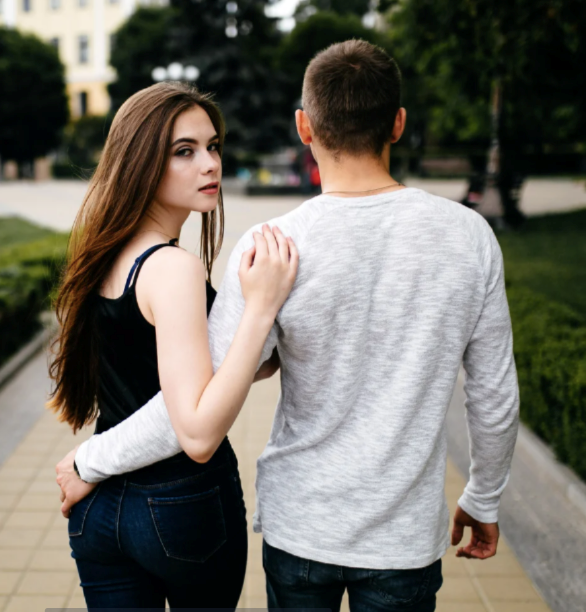 Young woman leaving a family party early with her boyfriend.