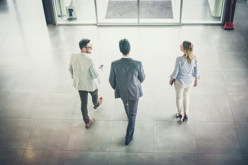 3 workers leave after a long day of work.