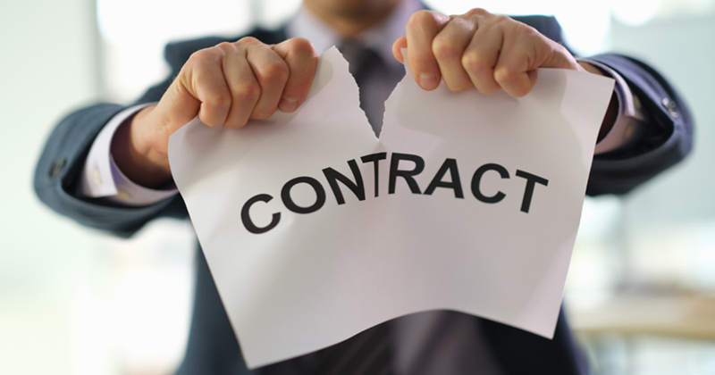 Businessman in Suit Tearing up Job Contract in Office Closeup