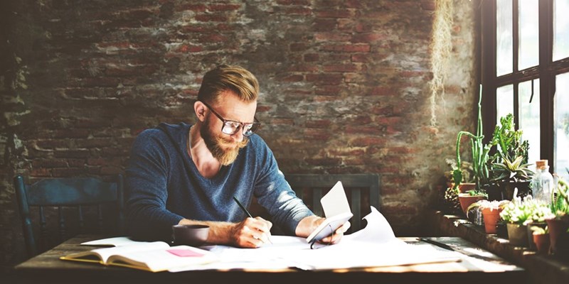 Poet writes from a journal.