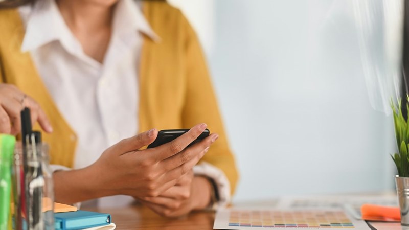 A closeup of a woman using a smartphone