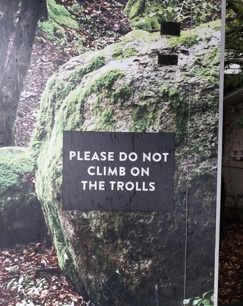 PLEASE DO NOT CLIMB ON THE TROLLS