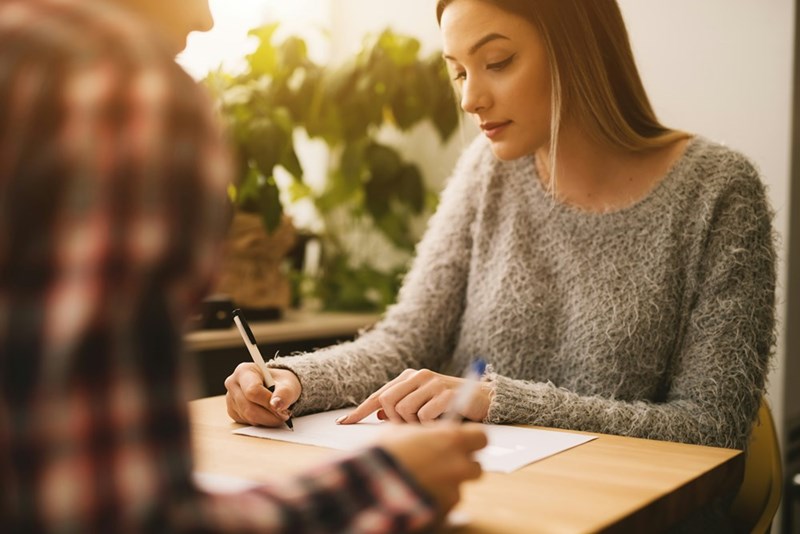 Worker fills out a form.
