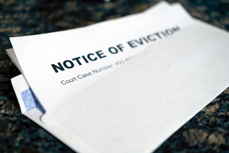 A close up piece of paper with a notice of eviction on it
