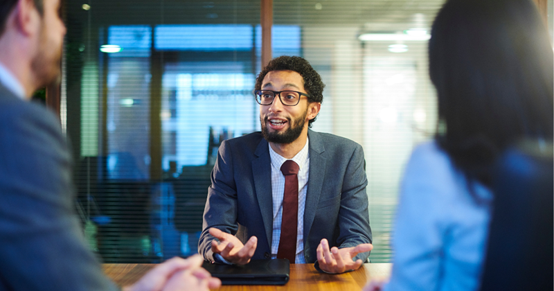 Job-seeker working hard to make a good impression during his interview. 