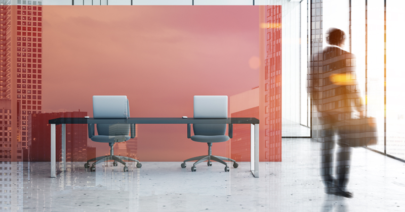 Businessman in red open space office