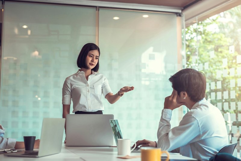 Boss explains to employee why she's firing him.