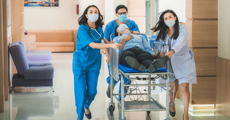 Emergency room nurses hurrying through the hospital to save someone.