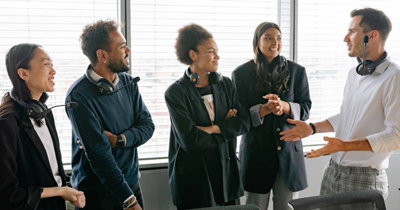 Coworkers sharing stories at a work event. 