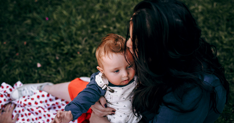 Aunt embracing her nephew while she waits for her brother to come pick him up.
