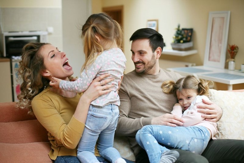 Portrait of family having fun in the living room