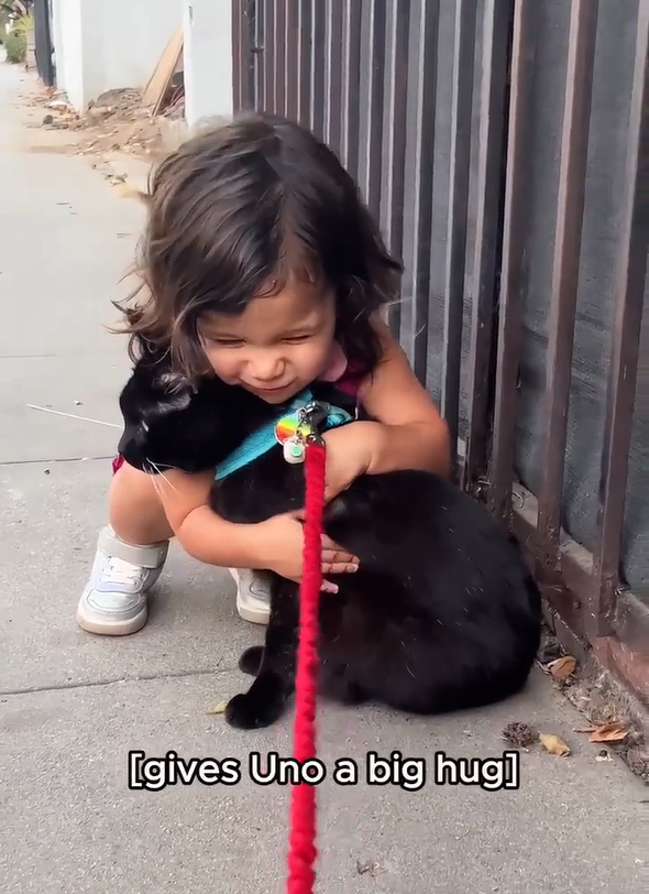 [gives Uno a big hug]