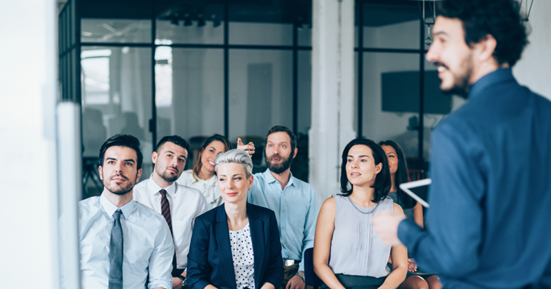 A group of people during business training.