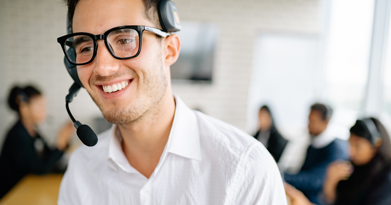Man looking smug in the office after maliciously complying with protocol. 