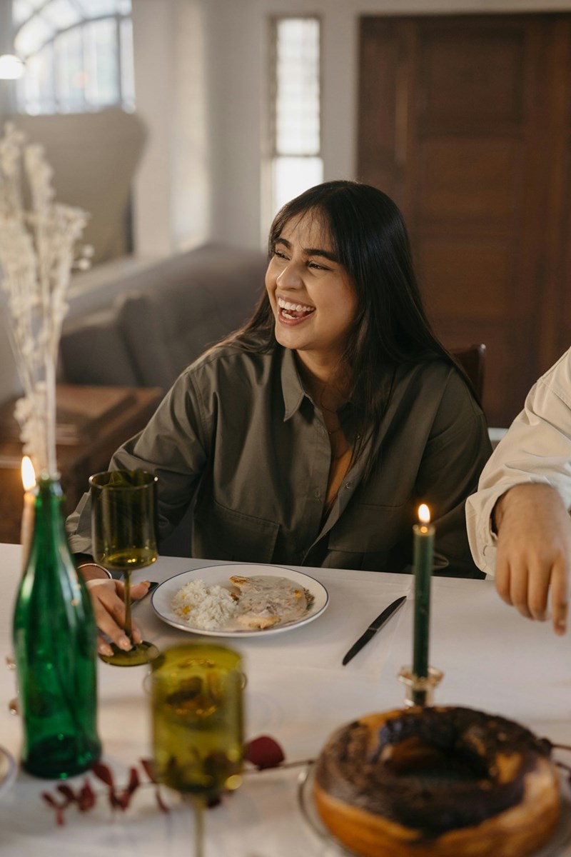 A man and a woman sitting at a dinner table