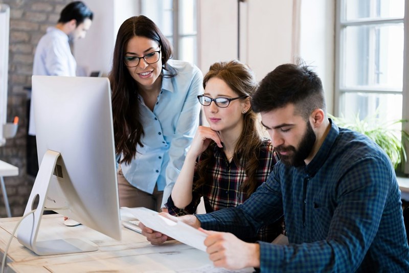 Young architects working on project in the office together