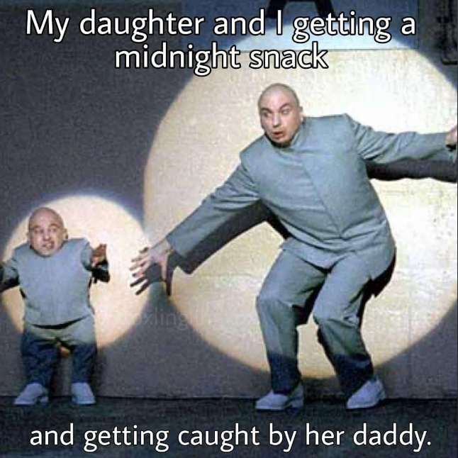 My daughter and I getting midnight snack a and getting caught by her daddy.