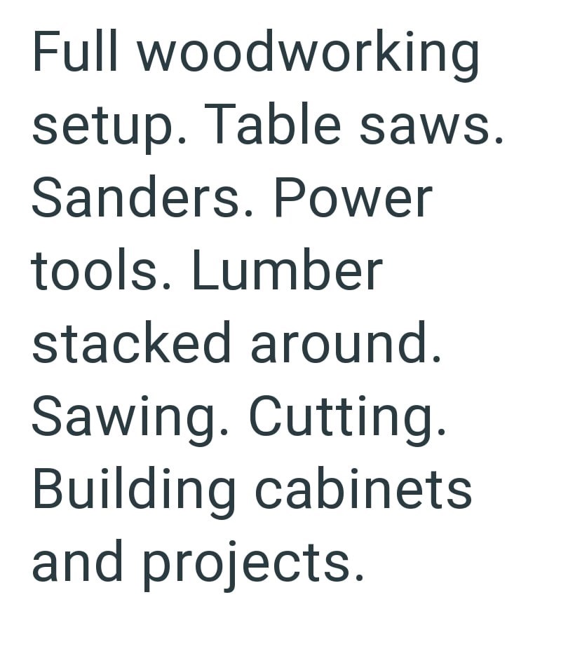 Full woodworking setup. Table saws. Sanders. Power tools. Lumber stacked around. Sawing. Cutting. Building cabinets and projects.