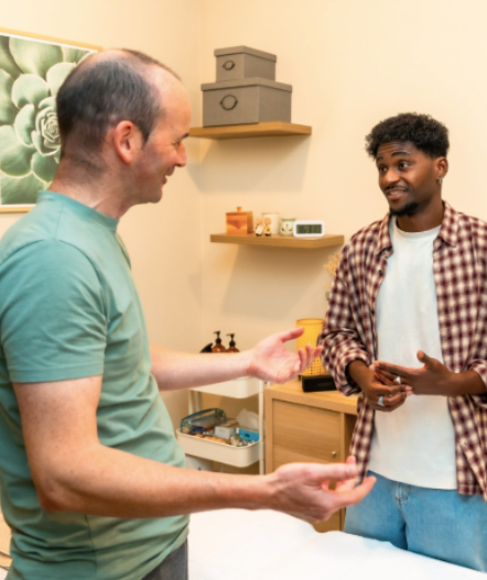 Two men discussing a problem in their shared building complex.