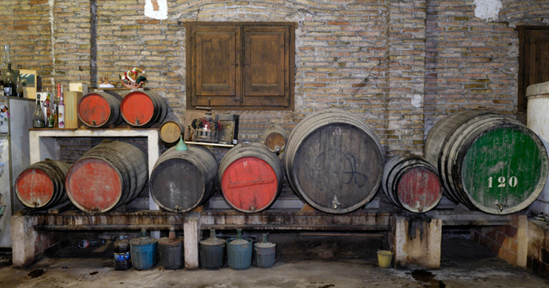 Dark cellar with antiques against the wall.
