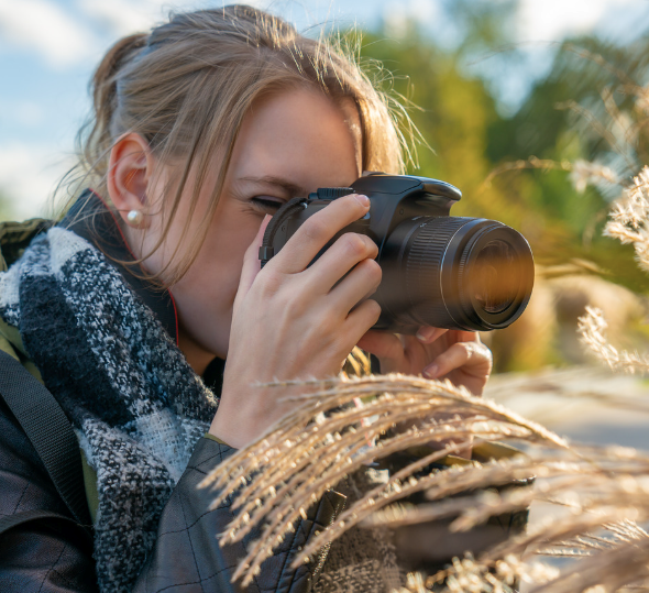 Woman taking photos for her sister to practice photography.