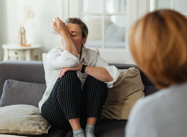 Two women settling a disagreement in the family living room.