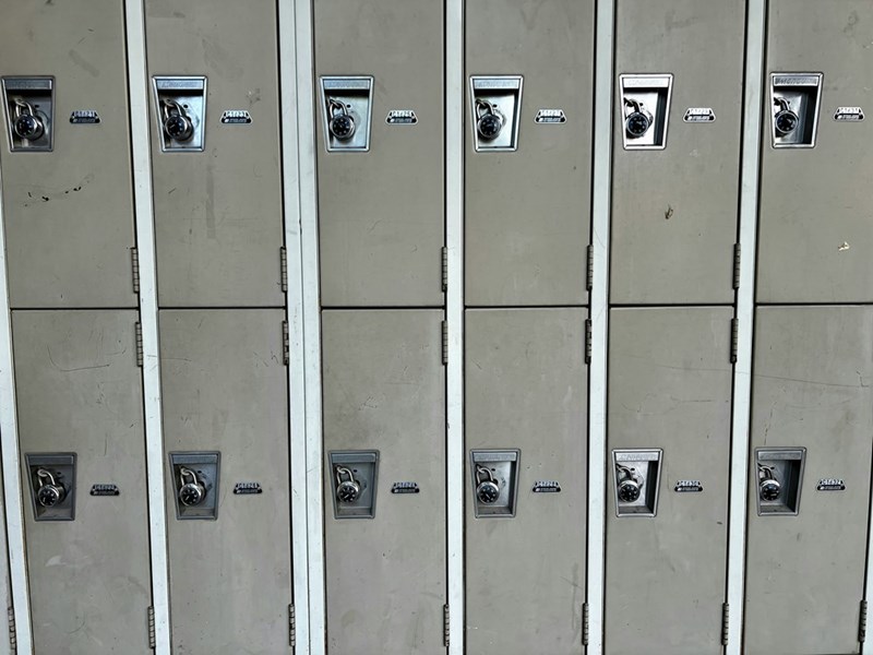 A row of metal lockers sitting next to each other