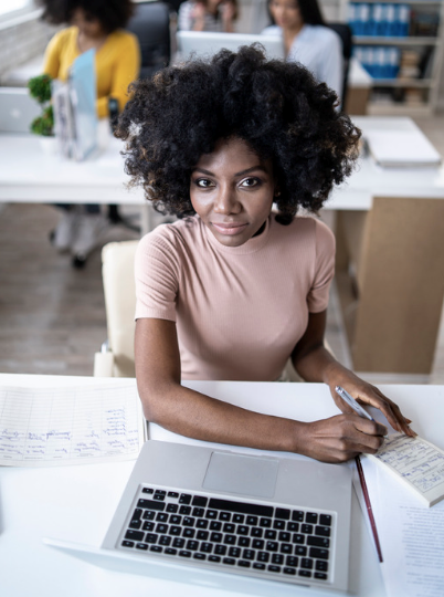 Female employee working at her desk on a PTO request.
