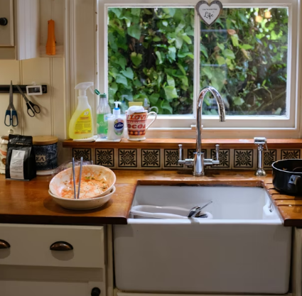 Dirty dishes in the sink left behind by irresponsible roommates.