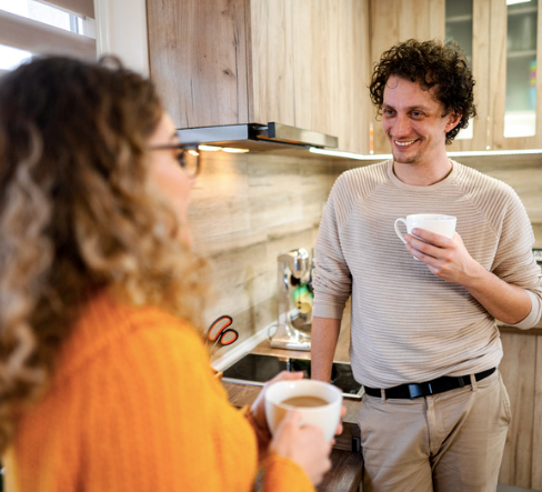 Young couple spending time together in the kitchen.