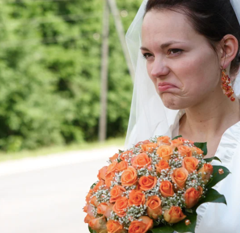 Bride looking upset with her bridal party's appearance.