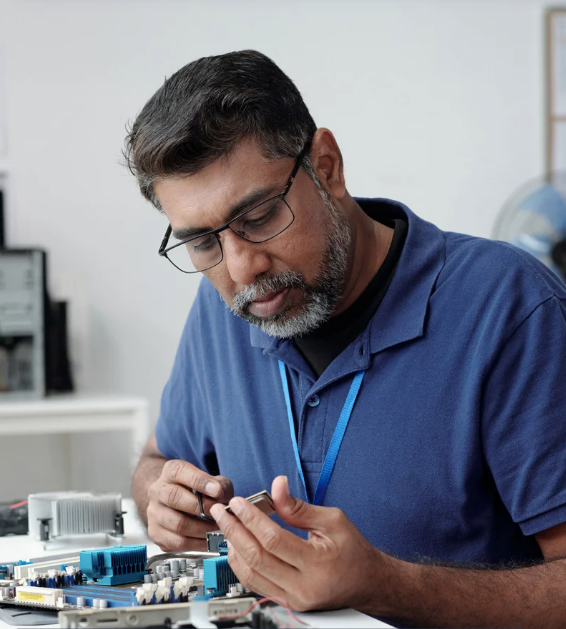 Senior engineer tinkering with a project at work.