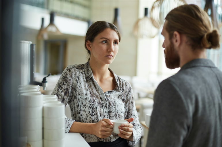 Girlfriend and boyfriend having a serious conversation in a restaurant.