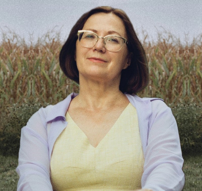 An older woman representing the mother-in-law from the story looks smugly at the camera