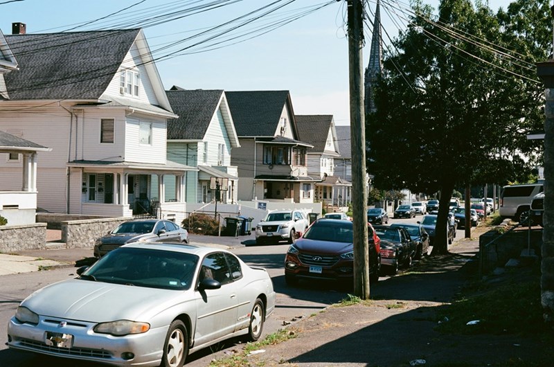 Neighbor vehicles frequently parked in front of residential homes.