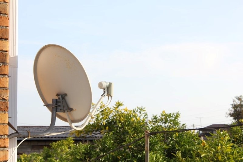 A satelite dish on a roof