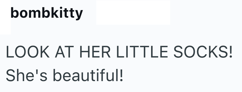 bombkitty LOOK AT HER LITTLE SOCKS! She's beautiful!