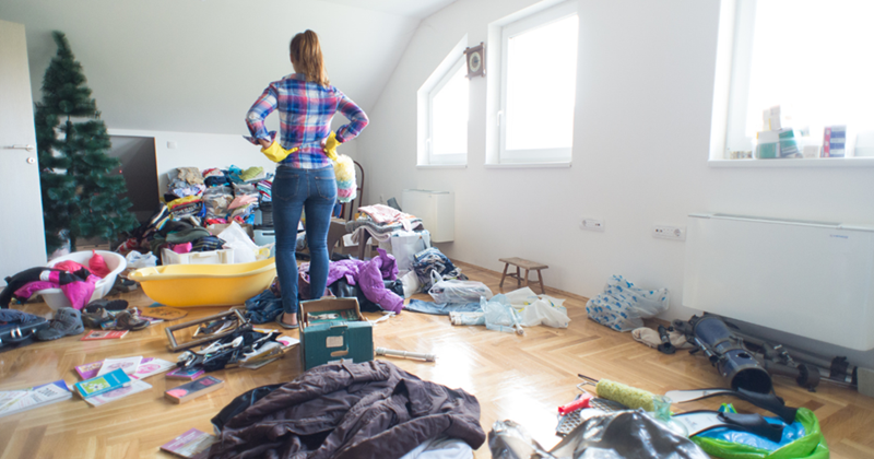 Woman cleaning a messy home