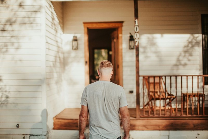 A man walking inside a house