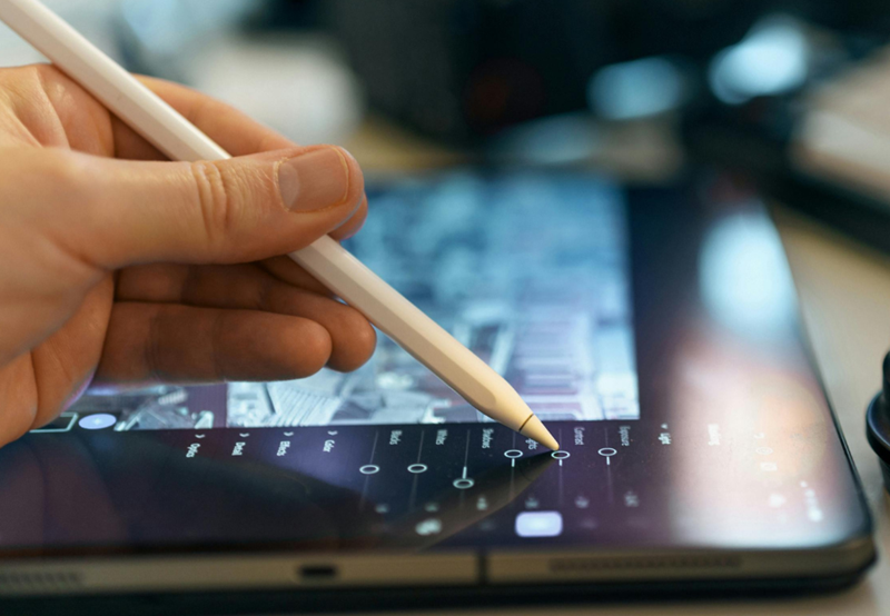 Graphic designer drawing on a tablet. 