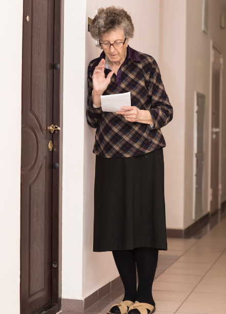 Older woman knocking on her neighbor's door. 