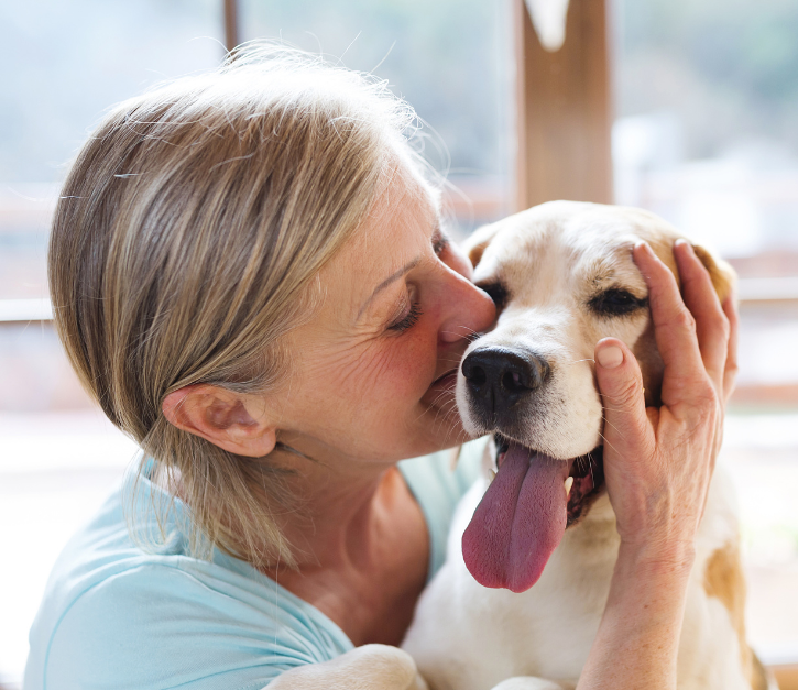 Woman enjoying her dog's company. 
